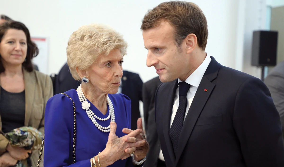 French President Emmanuel Macron with Academie Francaise Permanent Secretary Helene Carrere d’Encausse at the Global Forum on AI for Humanity in Paris. (Reuters)