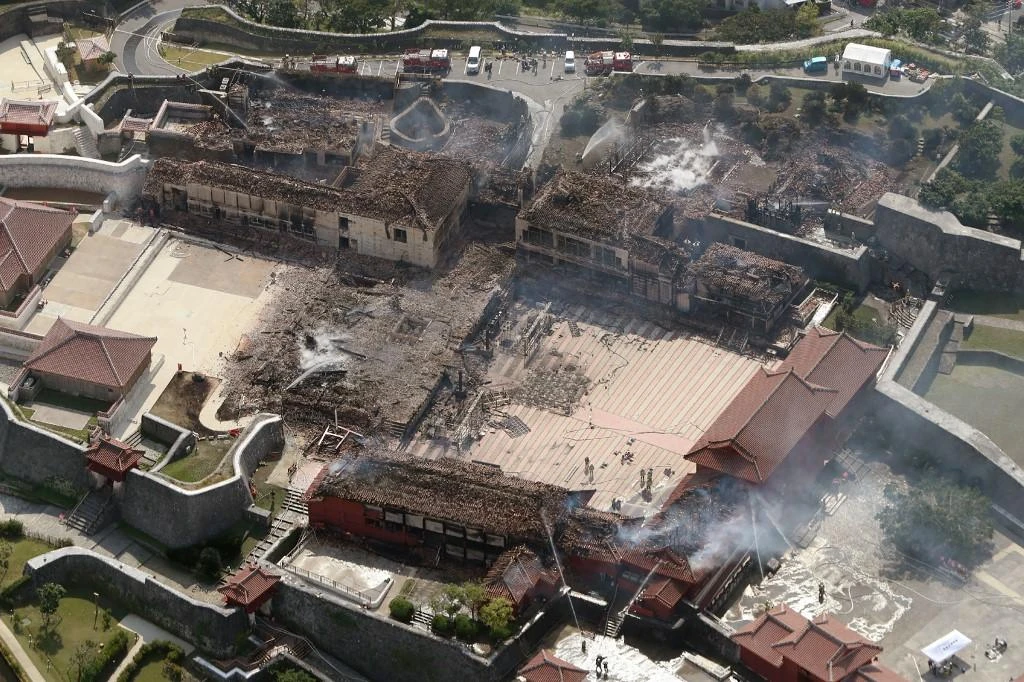 The fire was put out nearly 12 hours later, but by then most of the wooden castle’s major buildings had been reduced to charred skeletons. (File/AFP)