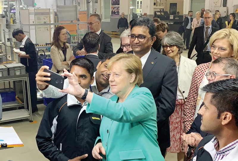 German Chancellor Angela Merkel visits Continental Automotive Components’ plant in the northern Indian state of Haryana on Saturday. (Reuters)