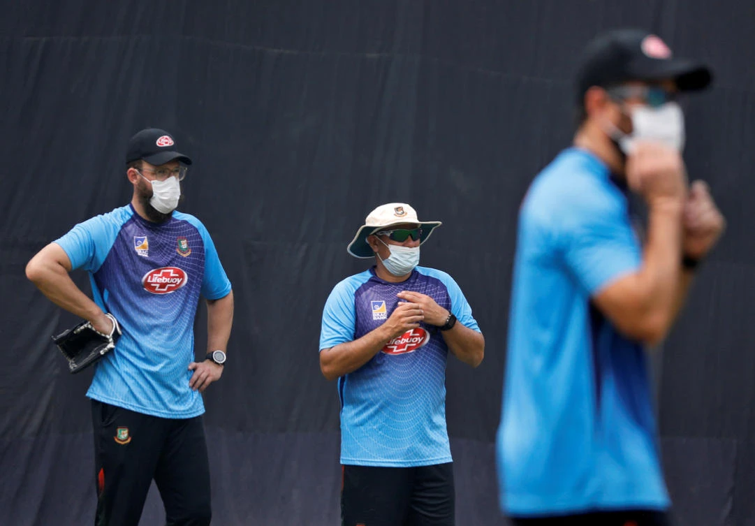 Bangladesh's bowling coach Daniel Vettori, head coach Russell Domingo and batting coach Neil McKenzie wearing masks look on during a practice session ahead of their Twenty20 cricket match against India in New Delhi on Nov. 1, 2019. (REUTERS/Anushree Fadnavis)