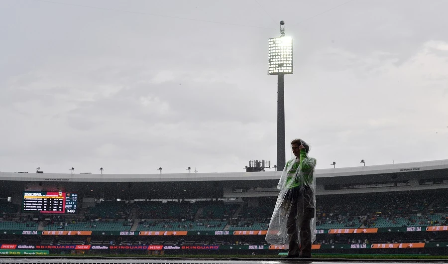 A volunteer is seen as the Twenty20 cricket match between Australia and Pakistan is halted due to rain at the Sydney Cricket Ground in Sydney on November 3, 2019. (AFP)