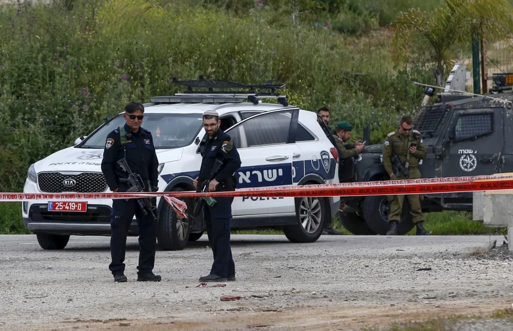 Israel's Justice Ministry says it will soon decide whether to file charges against a former policewoman who shot an unarmed Palestinian in the back with a sponge-tipped bullet. (File/AFP)