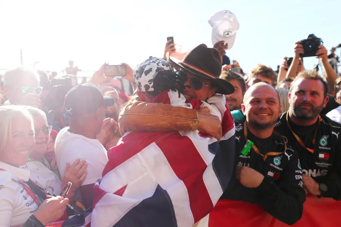 Formula One World Drivers Champion Lewis Hamilton of Great Britain and Mercedes GP celebrates with Matthew McConaughey during the F1 Grand Prix of USA at Circuit of The Americas on November 03, 2019 in Austin, Texas. (AFP)