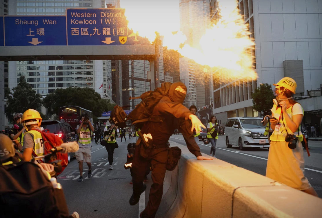 A demonstrator hurls a firebomb during a protest in Hong Kong, Saturday, Nov. 2, 2019. (AP)