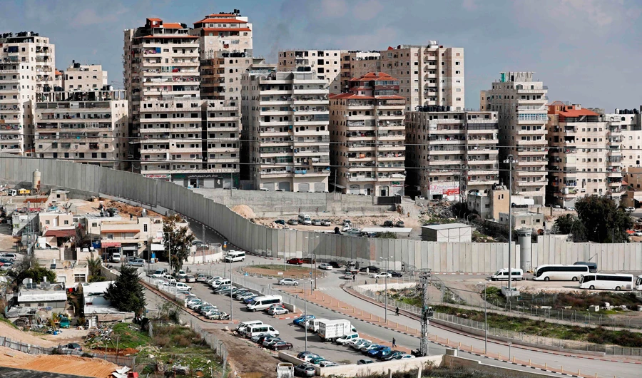 A general view taken on January 30, 2018 shows buildings in the Palestinian Shuafat refugee camp which is situated in East Jerusalem but surrounded by the Israeli controversial separation barrier. (AFP)