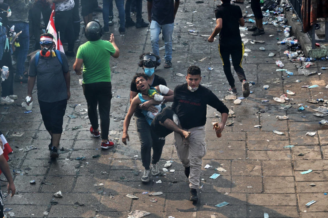 An injured protester is rushed to a hospital during anti-government demonstrations in Baghdad, Iraq, Tuesday, Oct. 29, 2019. (AP)