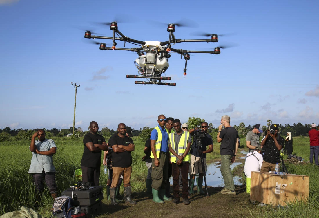 Trainee drone pilots from the State University of Zanzibar learn how to fly a drone to spray the breeding grounds of malaria-carrying mosquito in the southern Cheju region of the island of Zanzibar, Tanzania. (AP)