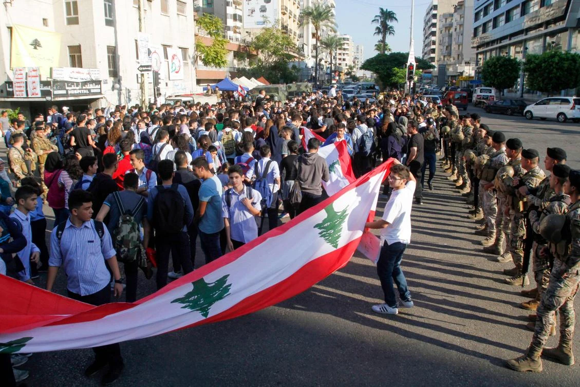Lebanese school students take part in a protest in the southern city of Sidon (Saida) on November 5, 2019, during ongoing anti-government protests. (AFP)