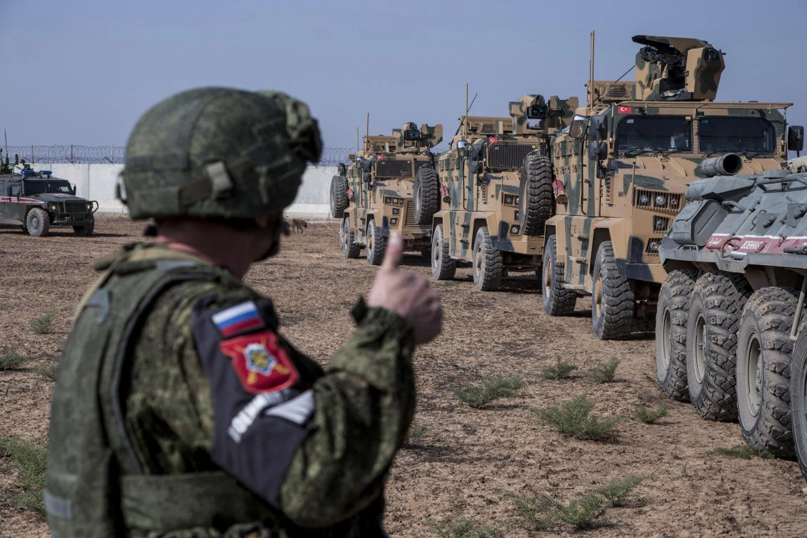 Turkish and Russian patrol is seen near the town of Darbasiyah, Syria, Friday, Nov. 1, 2019. (AP)