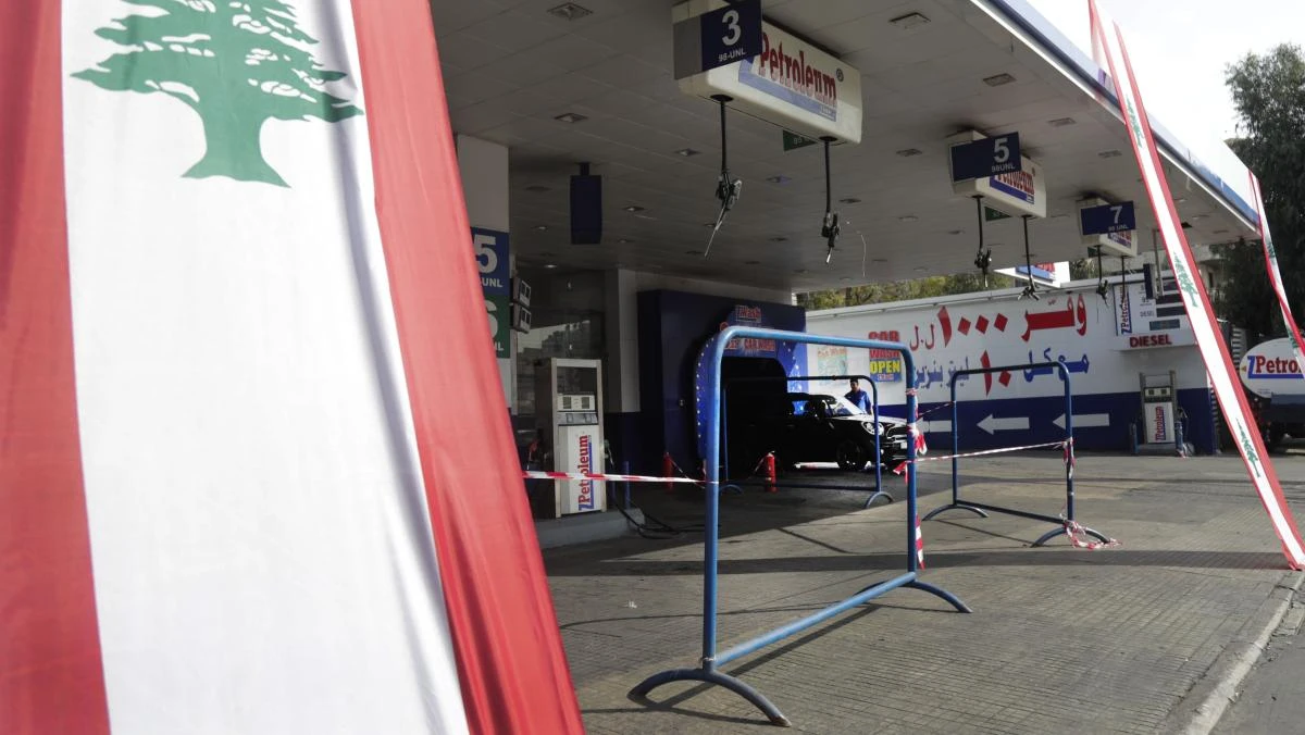 Petrol stations receive payment from customers in Lebanese pounds but have to pay importers and suppliers in dollars. (AFP)