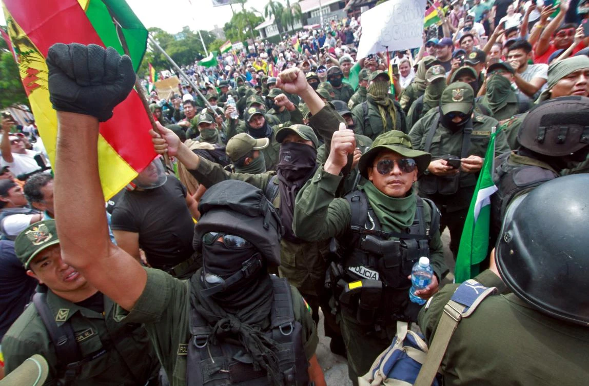 Police officers, who have joined a rebellion, take part in a march to protest against Bolivian President Evo Morales in Santa Cruz, Bolivia, on November 9, 2019. (AFP)