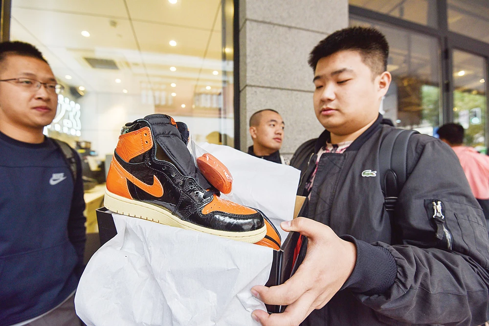 The Shanghai branch of the central People’s Bank of China issued a warning last month about the financial risks of excessive sneaker speculation. (AFP)