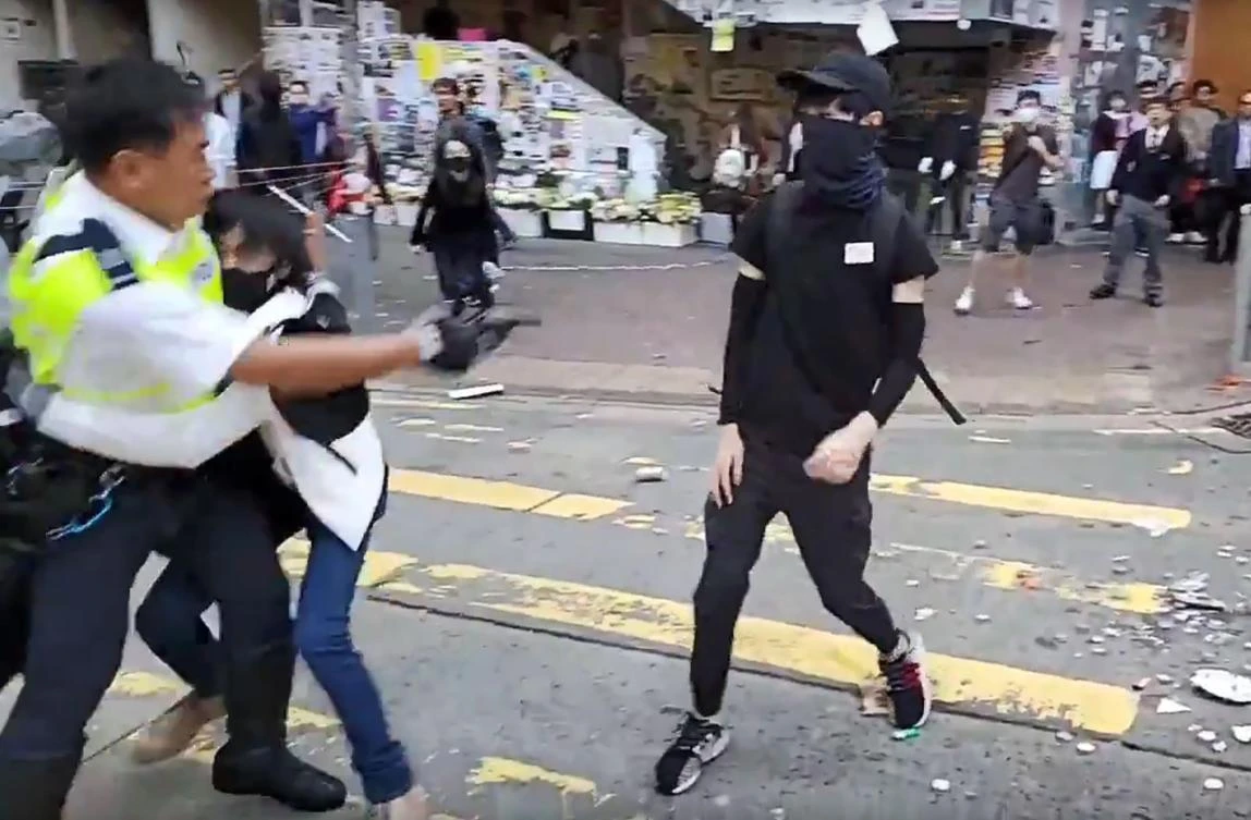 A video grab taken from Cupid News on Monday, November 11, 2019, shows a police man shooting a protester in the chest clashes in Sai Wan Ho district, in Hong Kong. (Cupid News/AFP)