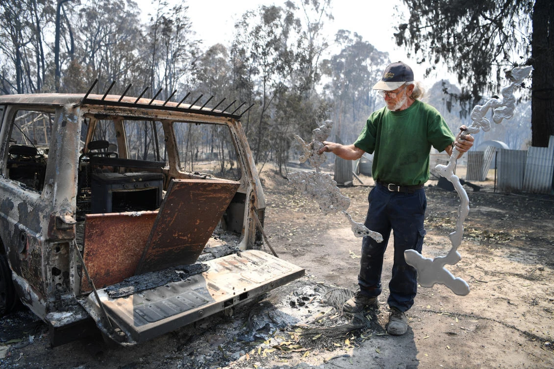 Fires in New South Wales’ northeast have claimed three lives, destroyed more than 150 homes and razed more than 850,000 hectares of forest and farmland since Friday. (AAP via Reuters)