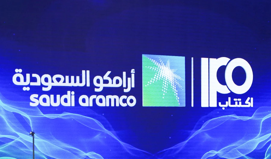 In this file photo taken on November 03, 2019 shows a sign of Saudi Aramco's initial public offering (IPO) during a press conference by the state company in the eastern Saudi Arabian region of Dhahran. (AFP)