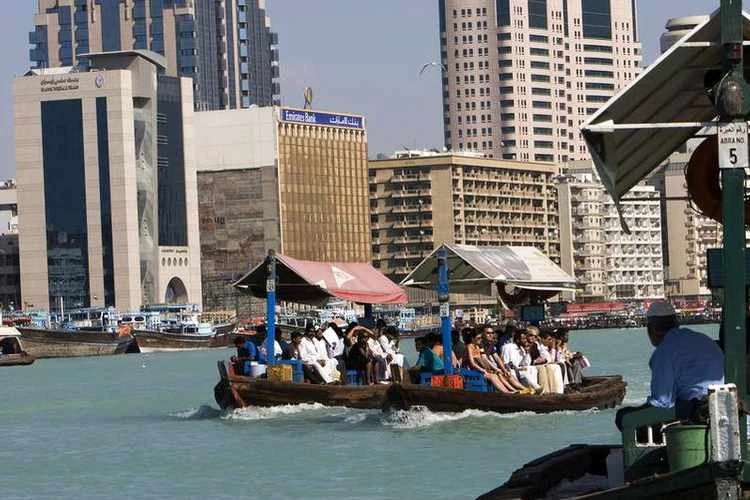 Water taxis, known as abra, displaying the diversity of Dubai’s population, cross the Creek. (Reuters)