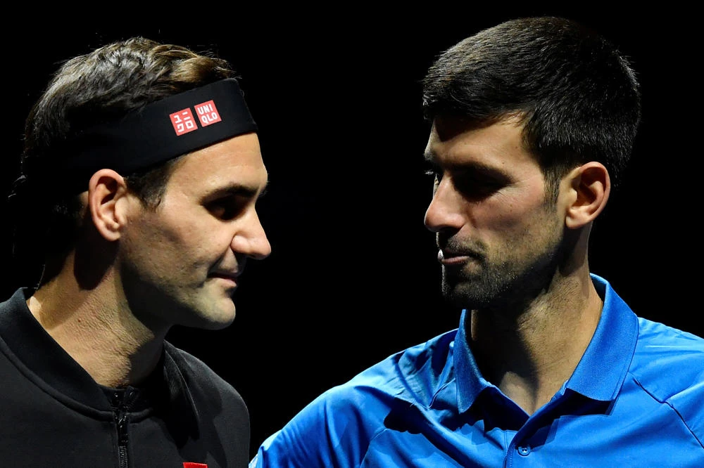 Switzerland's Roger Federer and Serbia's Novak Djokovic before their group stage match. ( REUTERS/Toby Melville)