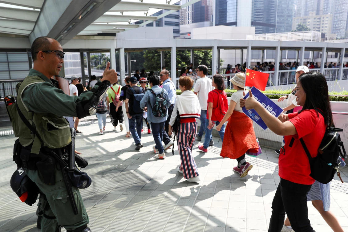 Mostly middle-aged and senior citizens, rallied outside the Hong Kong government’s headquarters to show support for the police. (Reuters)