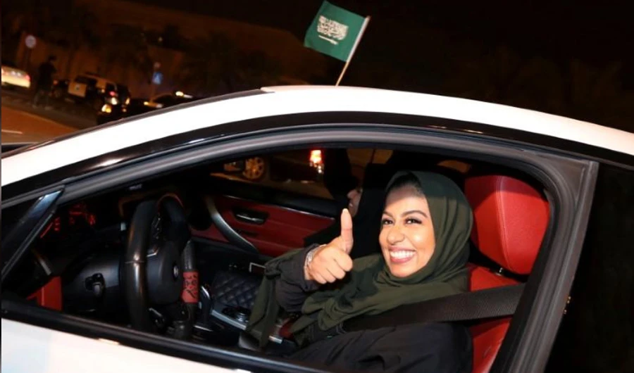 A Saudi woman celebrates as she drives her car in her neighborhood, in Al Khobar, Saudi Arabia, June 24, 2018. (REUTERS)