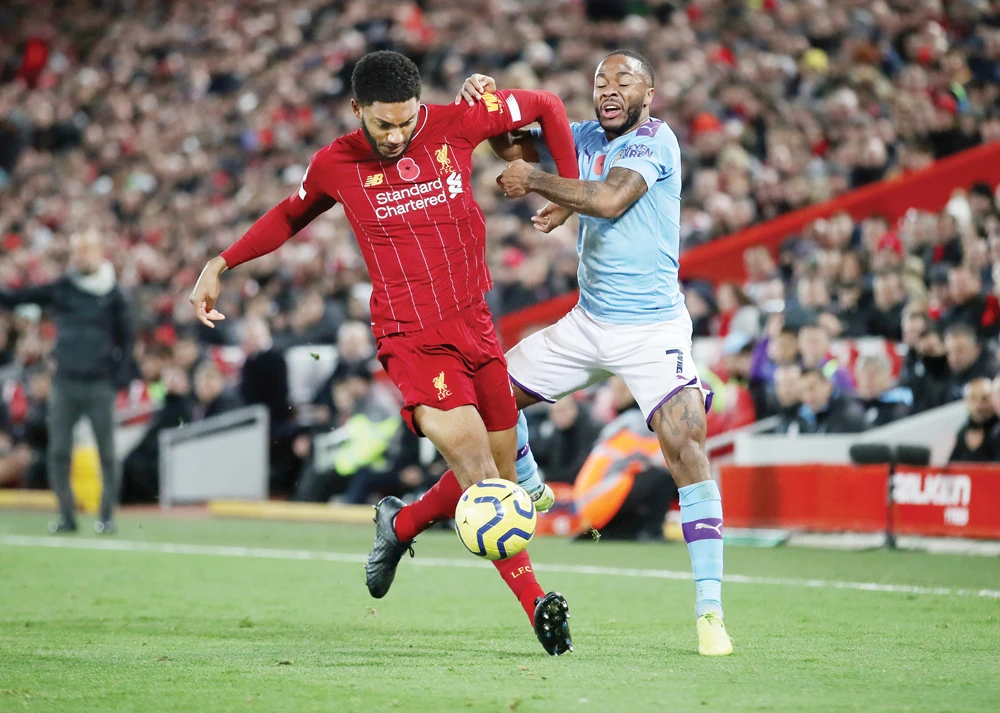 Liverpool’s Joe Gomez in action with Manchester City's Raheem Sterling during a recent Premier League match. Reuters