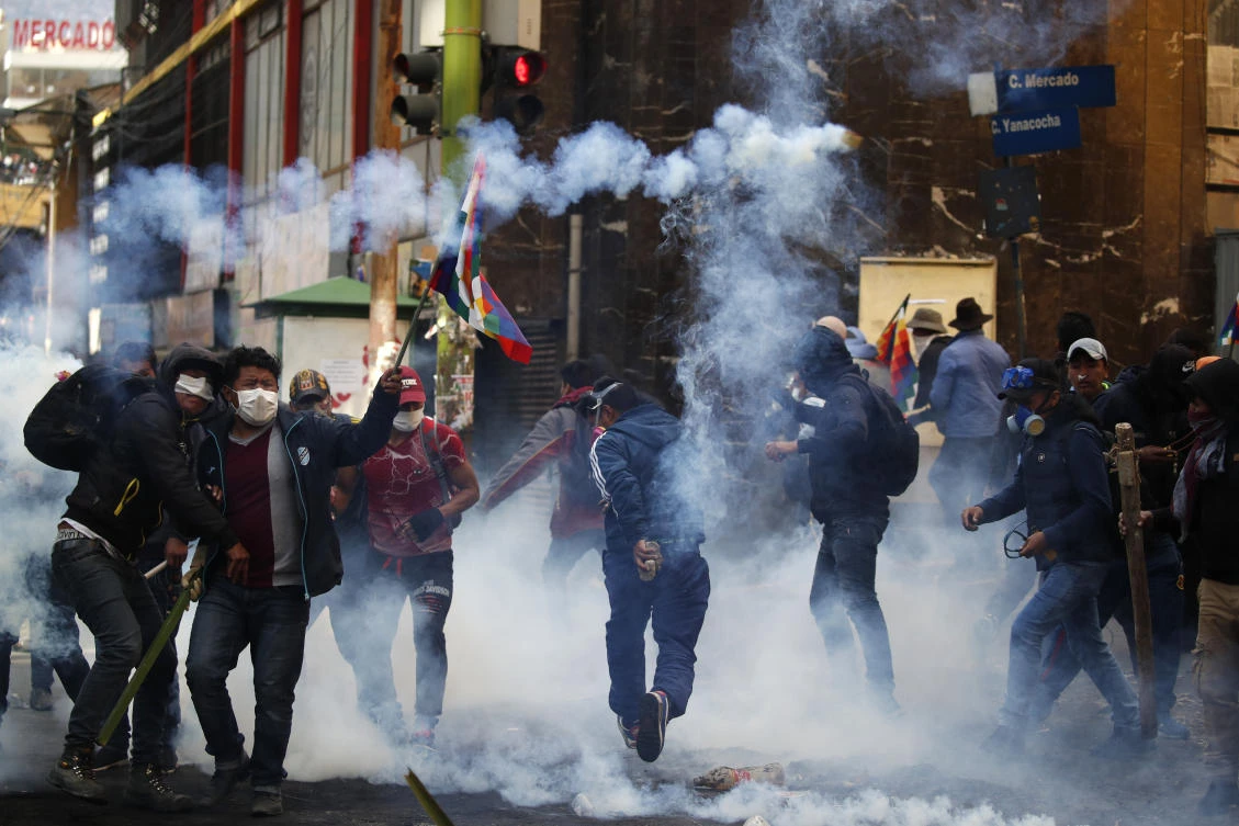 Police launch tear gas to disperse the supporters of former President Evo Morales in La Paz, Bolivia, Friday, Nov. 15, 2019. (AP)