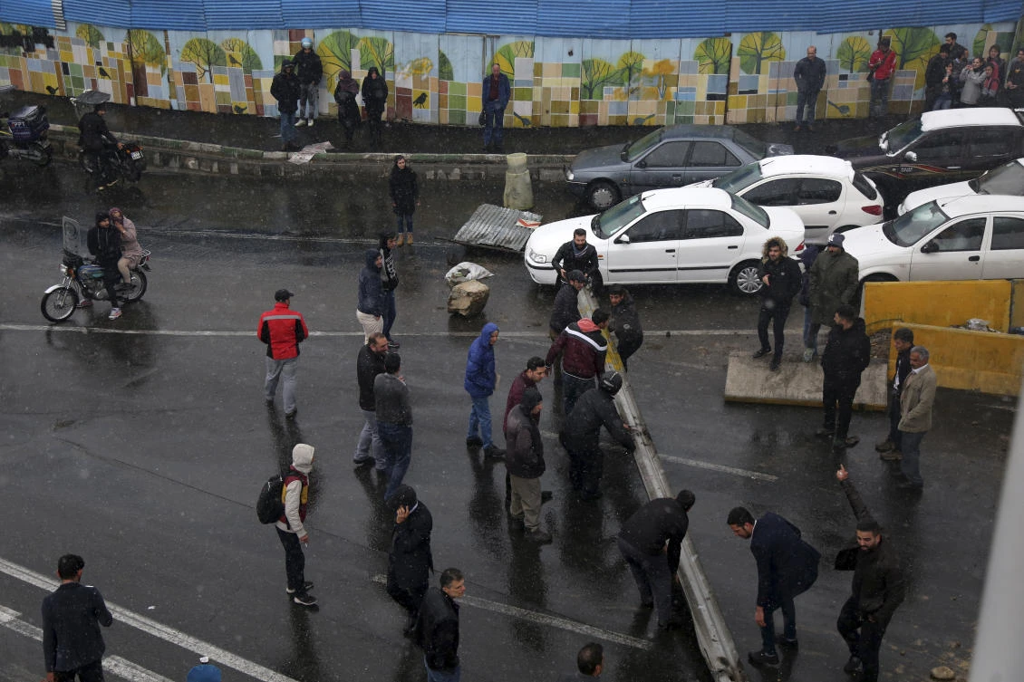 Protestors block a road after authorities raised gasoline prices, in Tehran, Iran, Saturday, Nov. 16, 2019. AP)