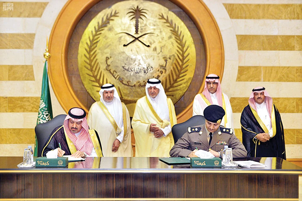 Makkah Gov. Prince Khaled Al-Faisal and Dr. Abdullah Al-Rabeeah, general supervisor of the King Salman Humanitarian Aid and Relief Center (KSRelief), witness the signing of an agreement to enhance aspects of cooperation in several areas. (SPA)