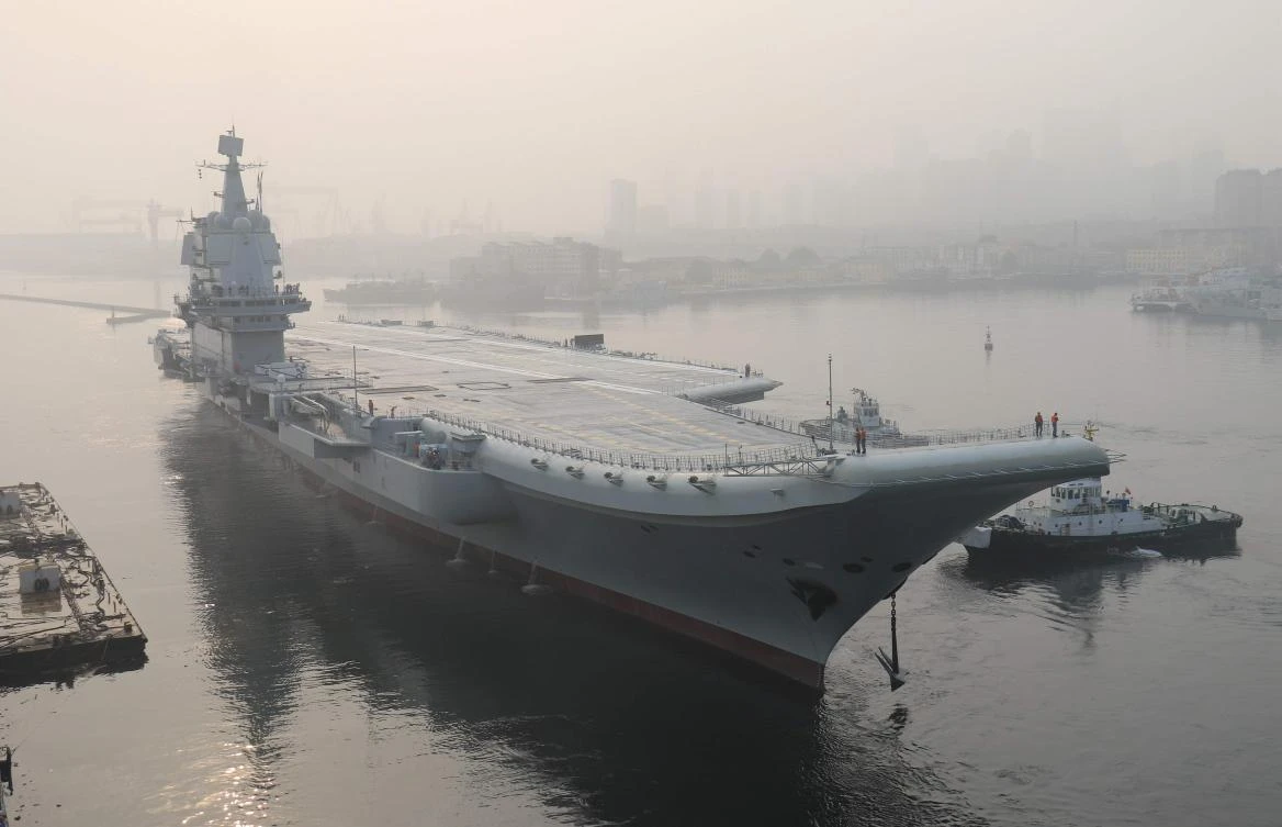 China’s first domestically manufactured aircraft carrier, known only as Type 001A, leaves port in the northeastern city of Dalian on May 13, 2018. (AFP file)