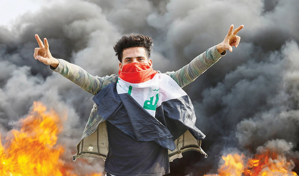 An Iraqi demonstrator during an anti-government protest on Monday. Protesters regained control of a bridge leading into the capital’s Green Zone on Sunday. (Reuters)