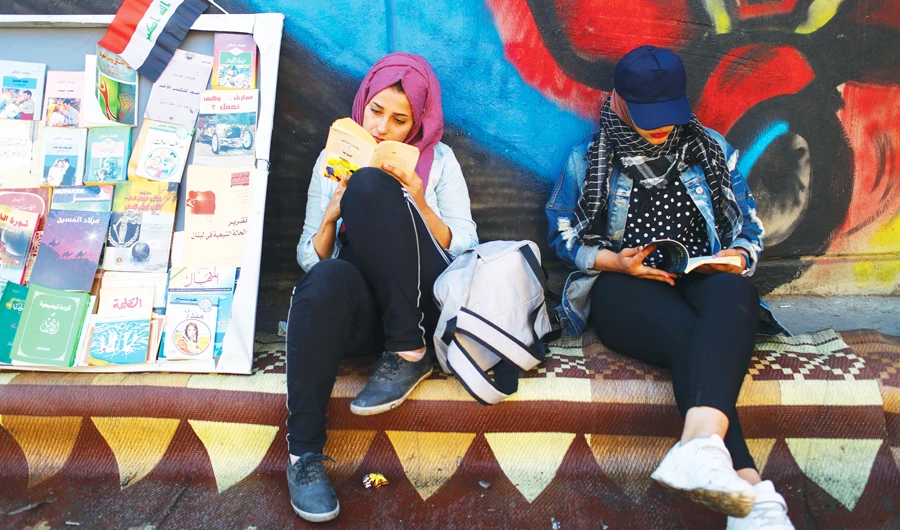 Demonstrators read books during a protest in Baghdad. More than 300 people have been killed during the recent anti-government protests in the country. (Reuters)