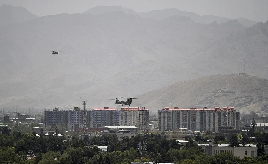A US military helicopter is seen flying towards the Green Zone in Kabul on August 3, 2019. (File/AFP)
