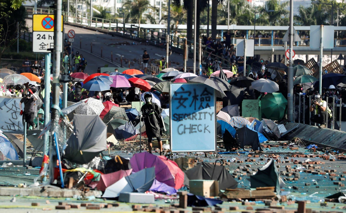 Protesters at Hong Kong Polytechnic University said around 50 of their number remained after hundreds had fled following official warnings that police may fire live rounds to clear the area. (Reuters)