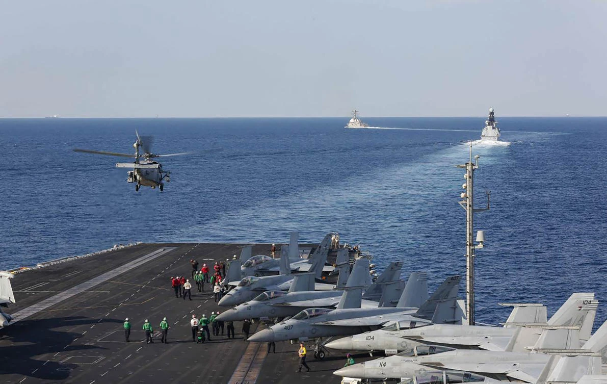 In this Tuesday, Nov. 19, 2019, photo made available by US Navy, a helicopter lifts off of the aircraft carrier USS Abraham Lincoln as it transits the Strait of Hormuz. (AP)