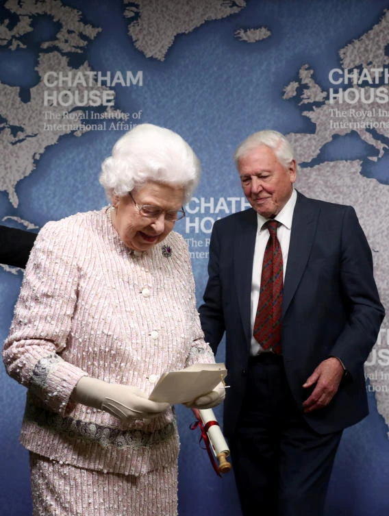 David Attenborough stands next to Britain's Queen Elizabeth during the annual Chatham House award ceremony, in London, Britain November 20, 2019. (Reuters)