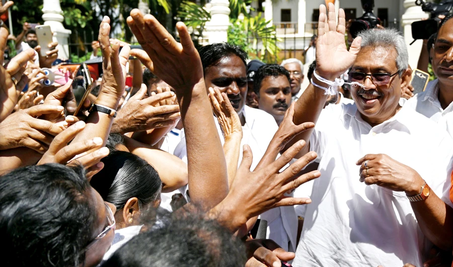 Lankan premier steps down to pave way for new regime