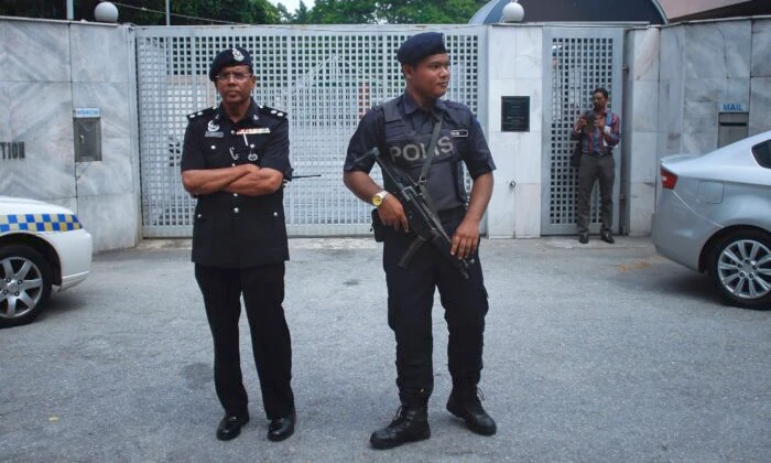 Around 150 immigration officers launched an early morning raid on sixth-floor office premises in the town of Cyberjaya, in Selangor. (Getty Images)