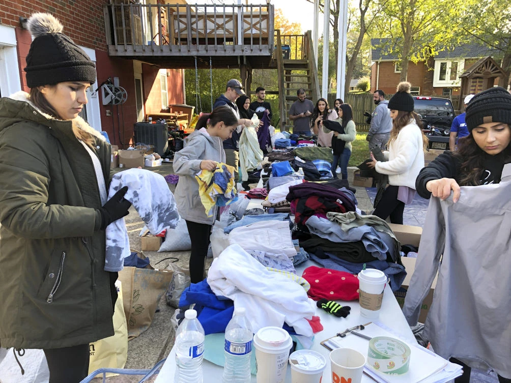 Members of the Kurdish community and supporters pack clothing donations in Nashville, Tennessee. (AP/Jonathan Mattise)