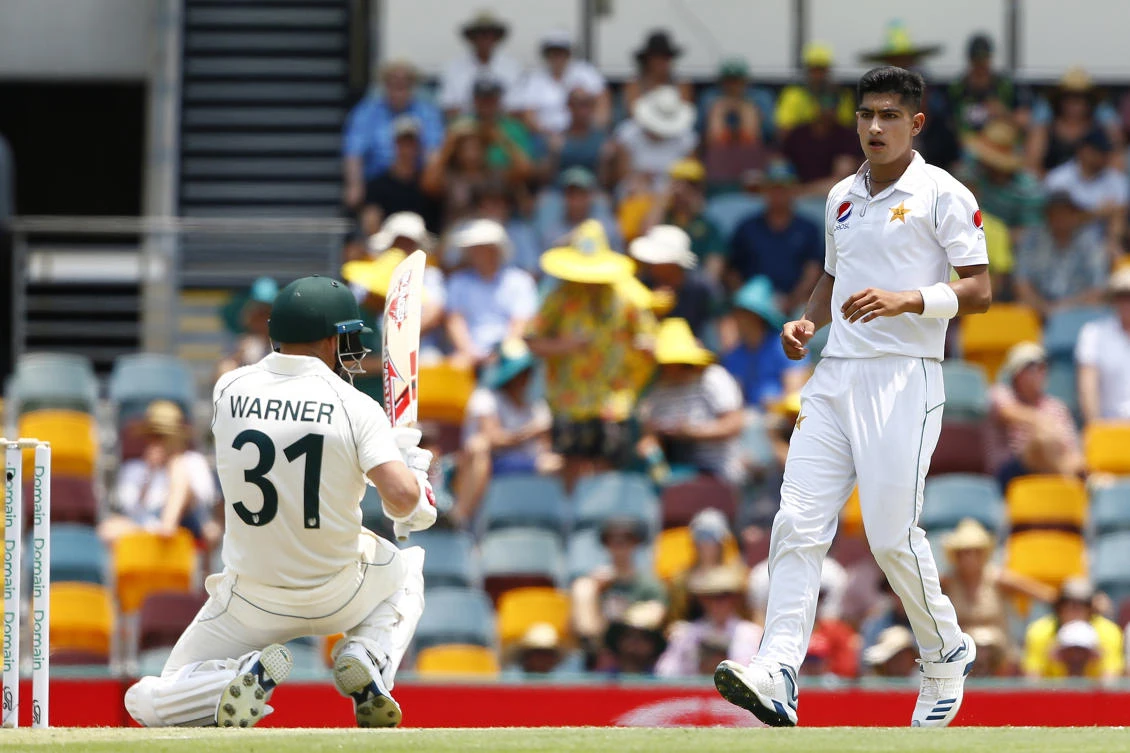 Pakistan’s Naseem Shah, right, stares at Australia’s David Warner, left, after he bowled a bouncer during their cricket test match against Australia in Brisbane on Friday, Nov. 22, 2019. (AP)