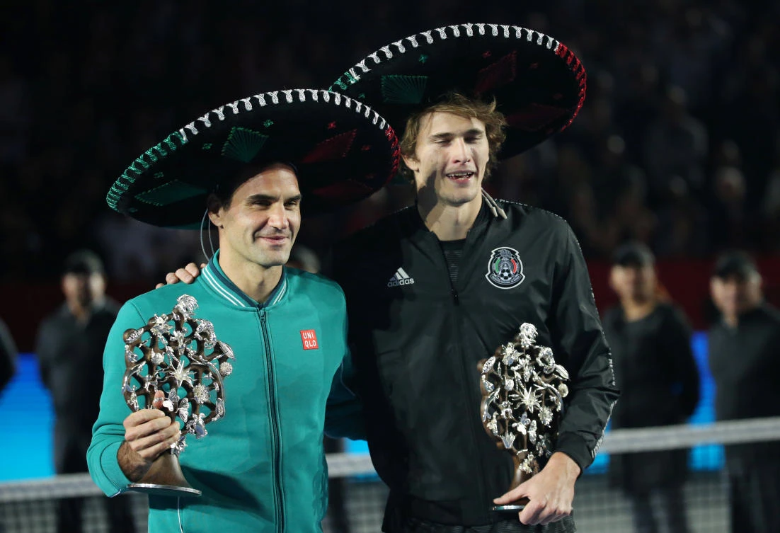 Switzerland’s Roger Federer, left, and Germany’s Alexander Zverev pose for a photo after the exhibition match in Mexico City. (Reuters)