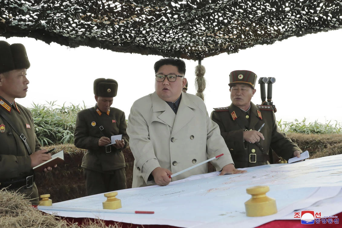 North Korean leader Kim Jong Un, center, inspects a military unit on Changrin Islet in North Korea in this undated photo. (KCNA via KNS/AP)