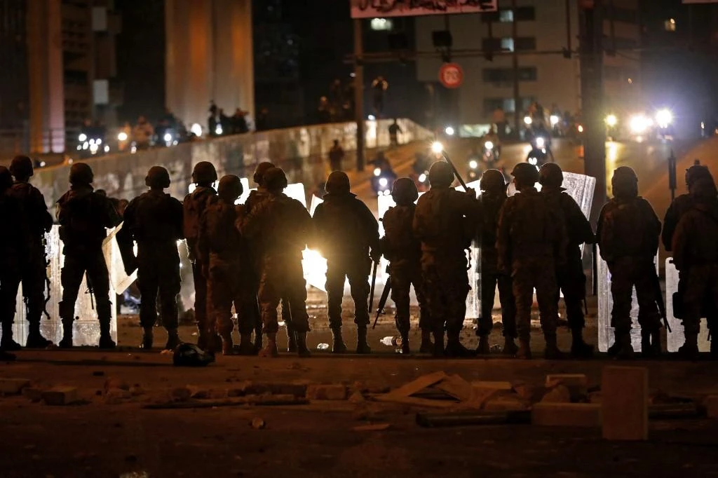 The confrontations began when protesters blocked the street and were attacked by supporters of the two main Shiite political parties, Hezbollah and Amal. (File/AFP)