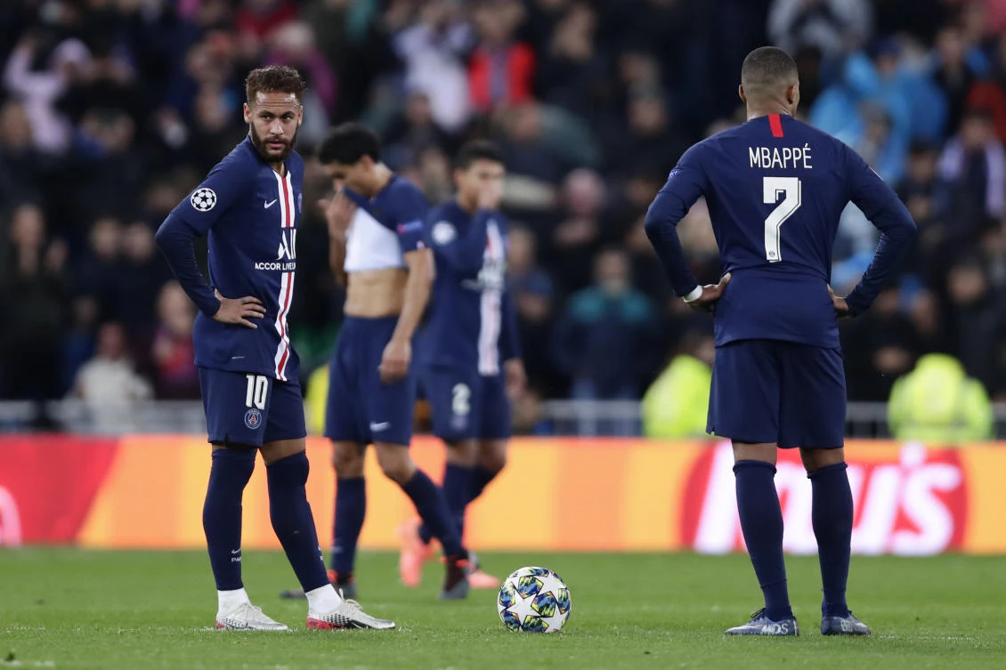 PSG’s Neymar, left, and PSG’s Kylian Mbappe react after Real Madrid’s Karim Benzema scored his side’s second goal during a Champions League soccer match in Madrid, Spain, Tuesday, Nov. 26, 2019. (AP)