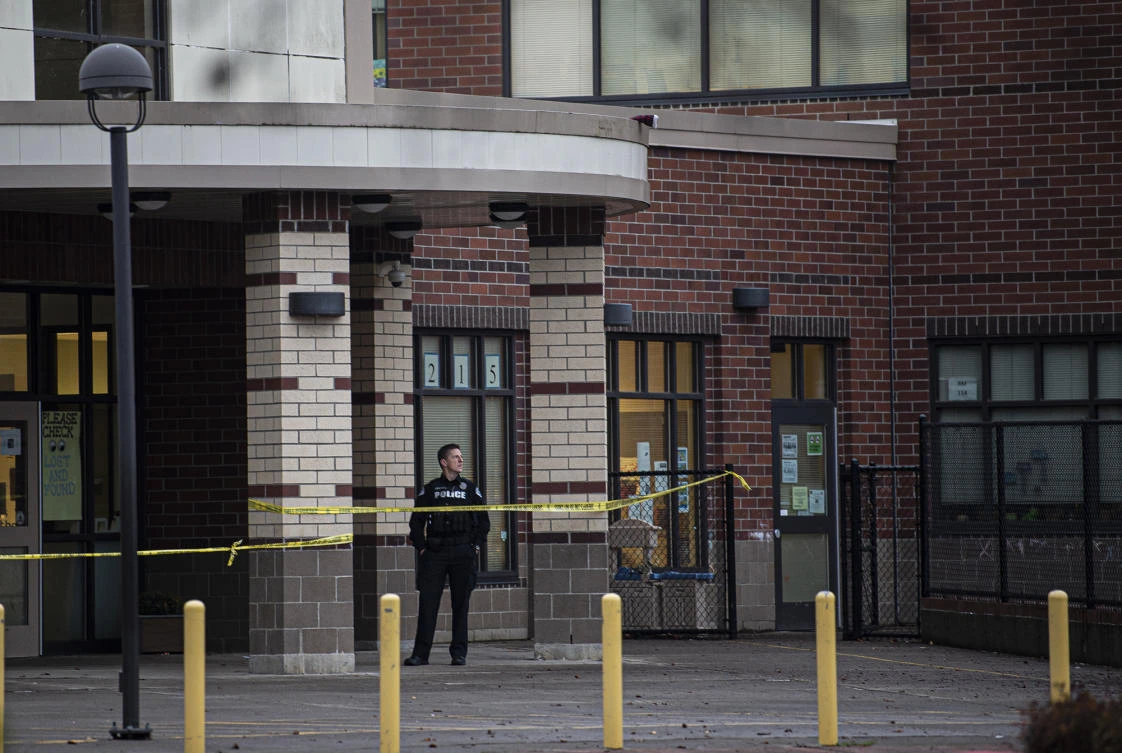 A Vancouver Police officer guards the entrance to Sarah J. Anderson Elementary School in Vancouver, Wash., following a shooting on the school's campus on Tuesday, Nov. 26, 2019. (AP)