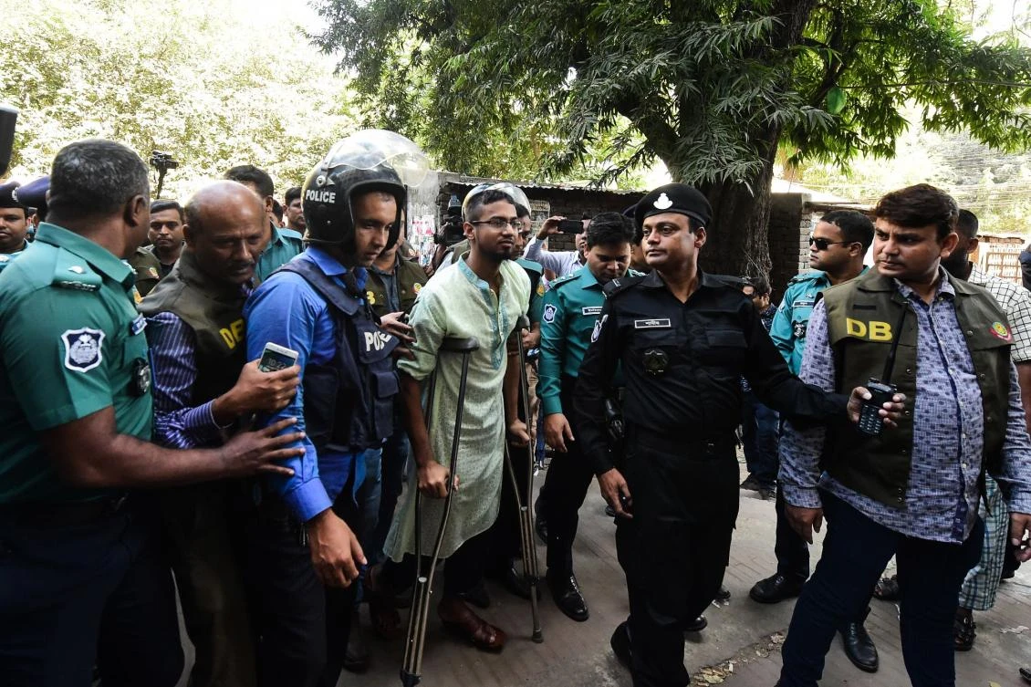 Bangladeshi police escort detainees, accused of allegedly plotting the July 1, 2016 Holey Artisan Bakery cafe attack, for their trial in Dhaka on November 27, 2019. (AFP)