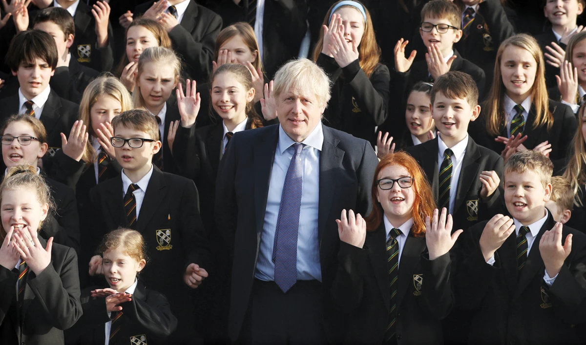 Britain’s Prime Minister Boris Johnson joins the Chulmleigh College school choir while campaigning on Thursday in southwest England. (AFP)