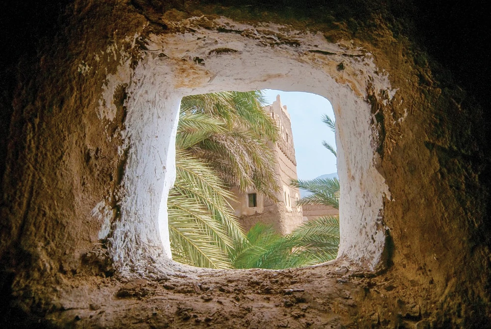 Najran's Eimarah Palace as seen from the window of another mud house nearby. (Saudi Tourism photo)