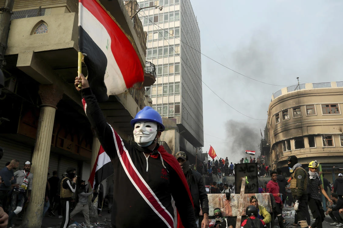 Anti-government protesters gather on Rasheed Street during clashes with security forces in Baghdad, Iraq, Friday, Nov. 29, 2019. (AP)