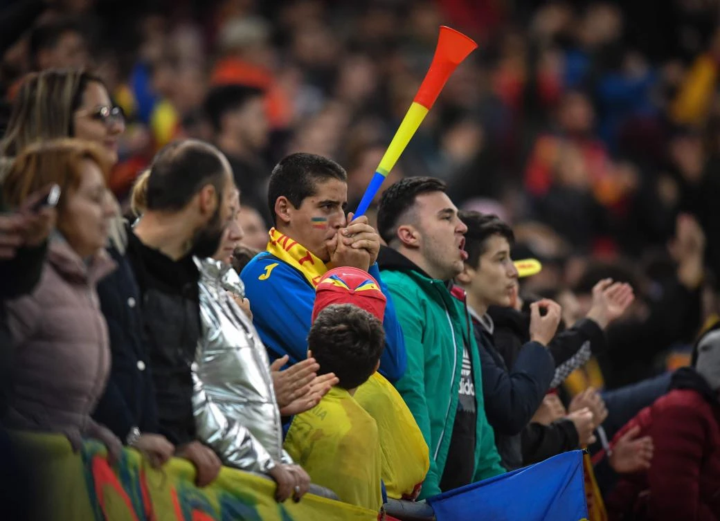 Romania’s national football team fans cheer during the UEFA Euro 2020 qualifier match against Sweden at the National Arena stadium in Bucharest, on November 15, 2019. (AFP)
