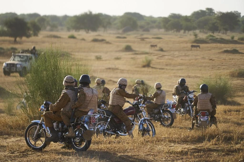 A group of soldiers of the Burkina Faso Army patrols a rural area during a joint operation with the French Army in the Soum region in northern Burkina Faso on November 10, 2019. (AFP)