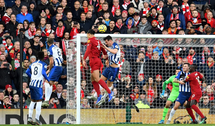 Virgil van Dijk scores Liverpool’s second goal during Saturday’s match. (AFP)